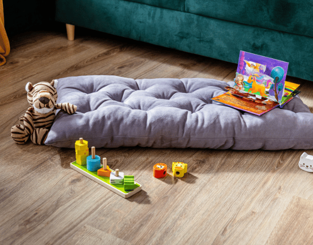 snug rocker for kids natural with grey pillow