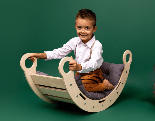 snug rocker for kids natural with grey pillow