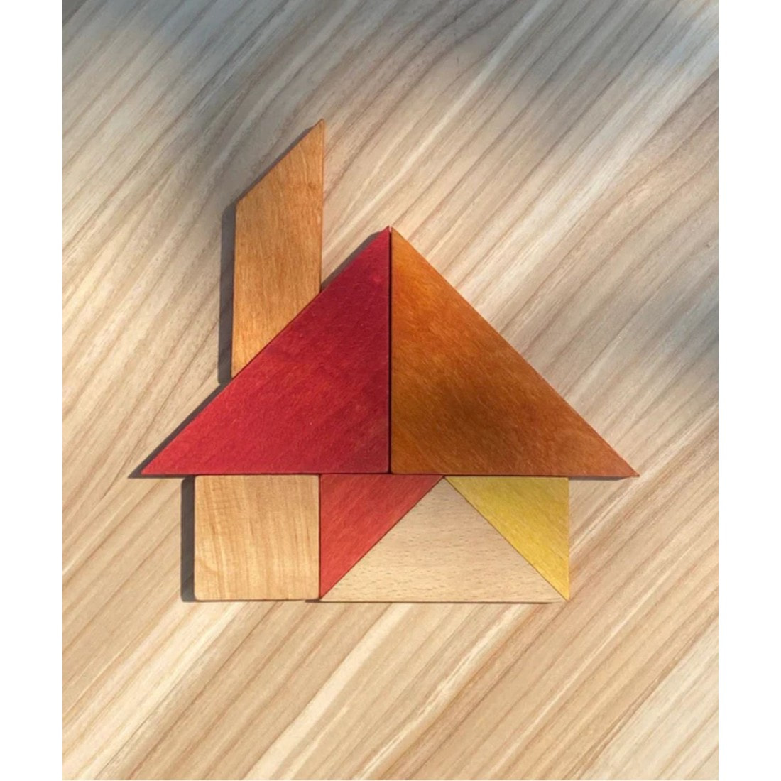 wooden story tangram – warm color (in storage bag)